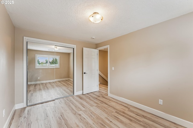 1722 Sequoia Ct, Forest Grove, OR 97116 - unfurnished bedroom with wood finished floors, a textured ceiling, and a closet