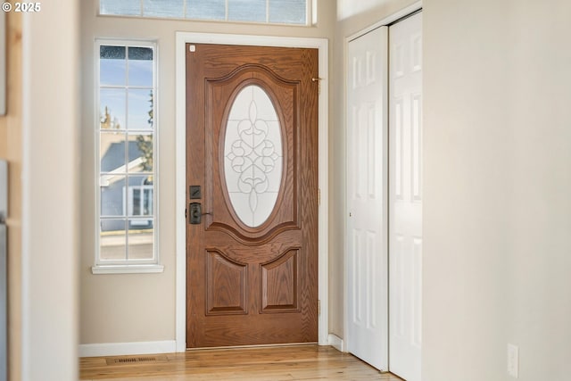 entrance foyer featuring a healthy amount of sunlight and light hardwood / wood-style floors