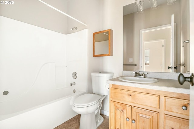 full bathroom featuring tile patterned flooring, vanity, bathtub / shower combination, and toilet