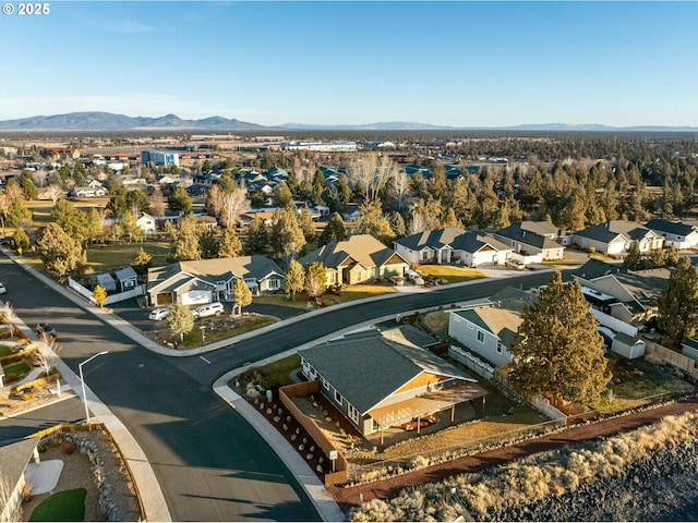 birds eye view of property with a mountain view