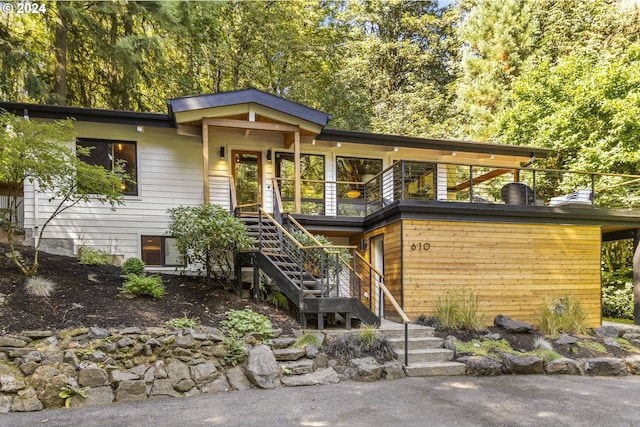 view of front of property featuring stairs