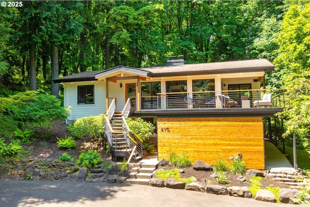 610 Atwater Rd, Lake Oswego, OR 97034 - view of front facade with stairs, a chimney, and a porch