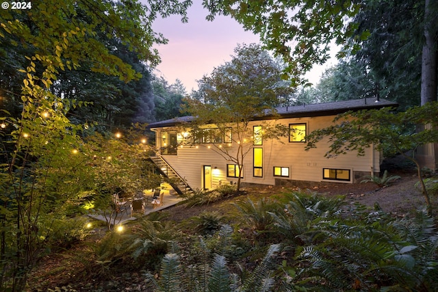 610 Atwater Rd, Lake Oswego, OR 97034 - back of property at dusk with stairs