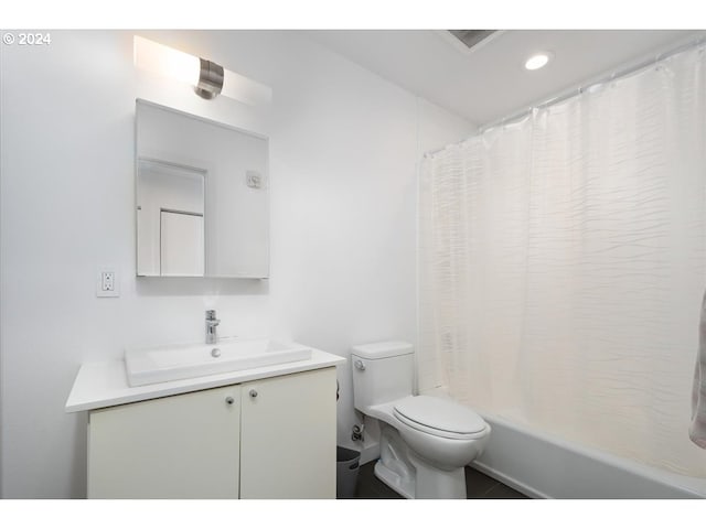 full bathroom with toilet, recessed lighting, shower / bath combo, and vanity