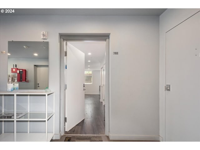 corridor featuring recessed lighting and wood finished floors