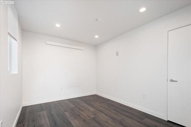 1480 N Jarrett St Unit 103, Portland, OR 97217 - unfurnished room with recessed lighting, dark wood finished floors, and baseboards