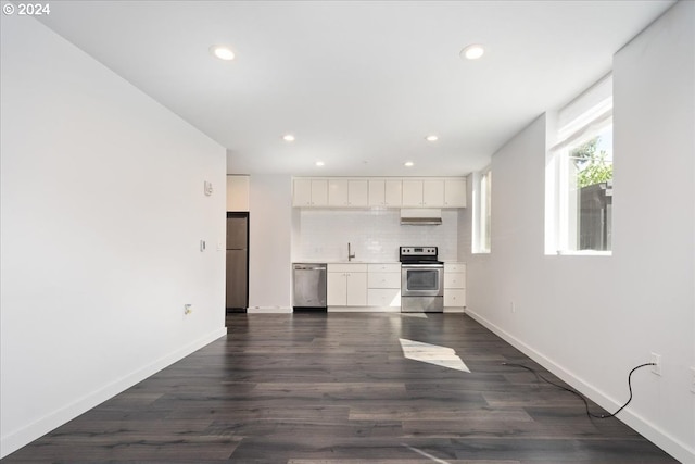 1480 N Jarrett St Unit 103, Portland, OR 97217 - interior space with baseboards, recessed lighting, white cabinetry, dark wood finished floors, and stainless steel appliances