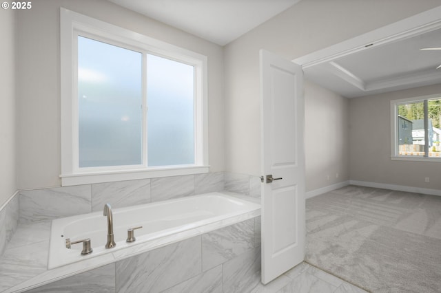 bathroom with tiled tub