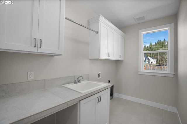 laundry room with cabinets, washer hookup, sink, and electric dryer hookup