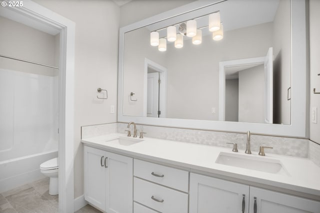 full bathroom with shower / tub combination, vanity, and toilet