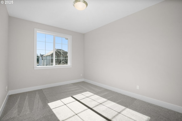 unfurnished room with carpet flooring