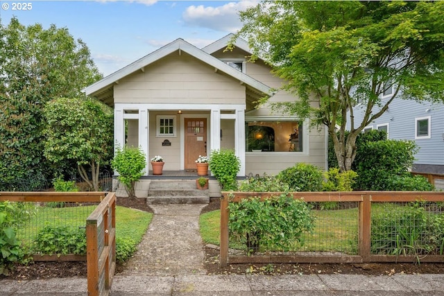 view of front of house featuring fence