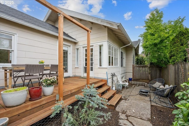 deck featuring fence and a patio