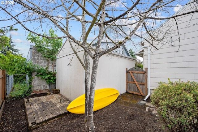 view of yard featuring fence and a gate