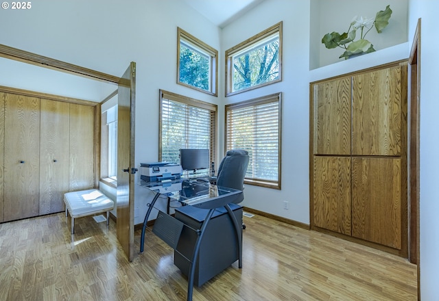 38201 Queens Rd, Marcola, OR 97454 - office space featuring baseboards, a high ceiling, and light wood-style floors