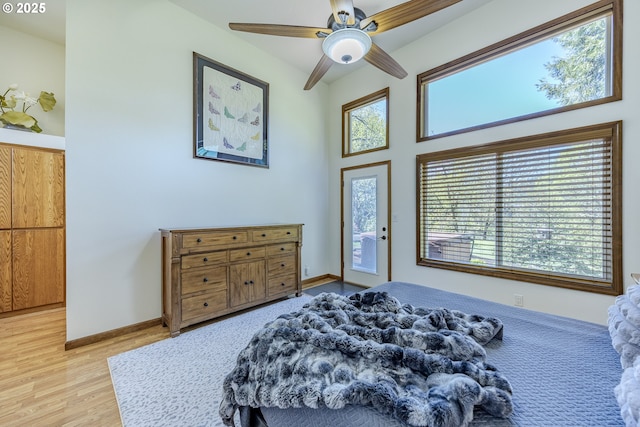 38201 Queens Rd, Marcola, OR 97454 - bedroom featuring a ceiling fan, baseboards, access to exterior, and light wood-style flooring