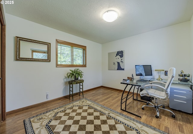 38201 Queens Rd, Marcola, OR 97454 - office area featuring baseboards, a textured ceiling, and wood finished floors