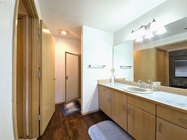 3300 NE 164th St Unit S-1, Ridgefield, WA 98642 - full bathroom with wood finished floors, vanity, a stall shower, and baseboards