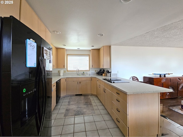 3300 NE 164th St Unit S-1, Ridgefield, WA 98642 - kitchen with black appliances, light brown cabinets, a peninsula, a sink, and light tile patterned floors