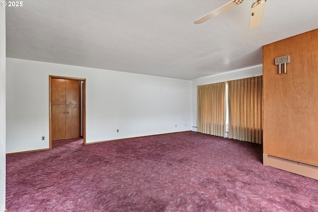 901 H Ave, La Grande, OR 97850 - empty room featuring carpet flooring, a ceiling fan, a baseboard heating unit, and baseboards