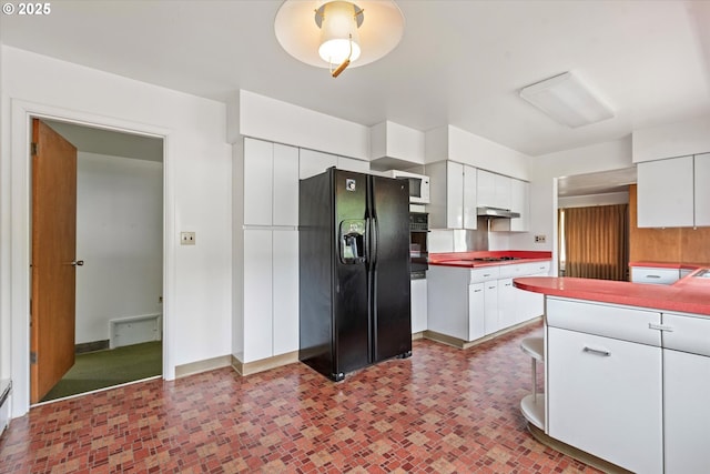901 H Ave, La Grande, OR 97850 - kitchen featuring black appliances, white cabinetry, under cabinet range hood, and baseboards