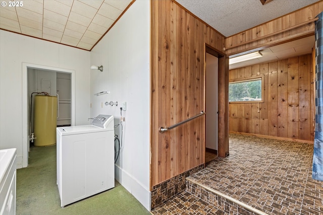 901 H Ave, La Grande, OR 97850 - washroom with wooden walls, brick patterned floors, water heater, baseboards, and ornamental molding