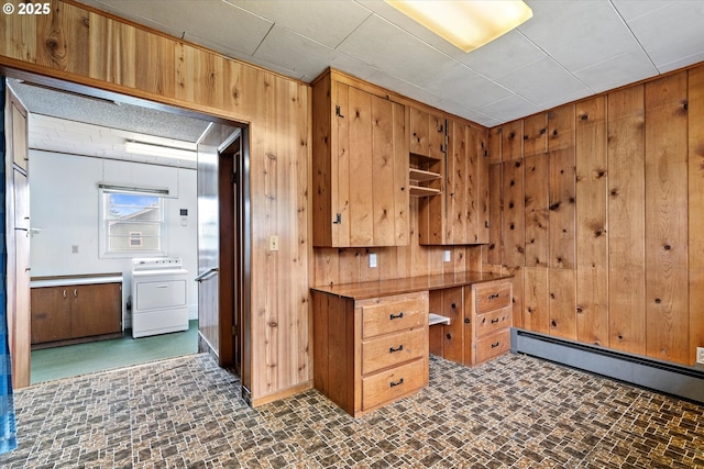901 H Ave, La Grande, OR 97850 - unfurnished office with washer / clothes dryer, wood walls, a baseboard radiator, and brick patterned floors