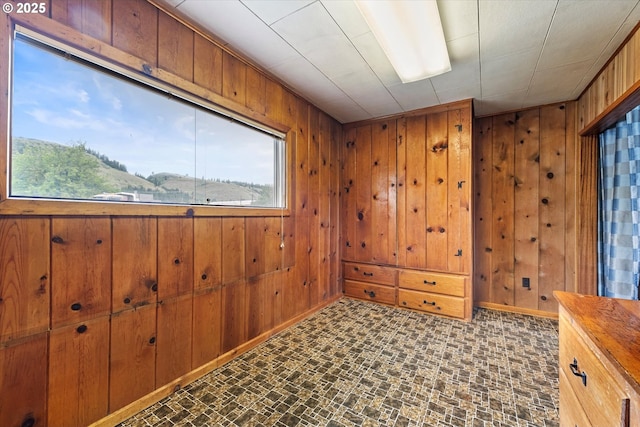 901 H Ave, La Grande, OR 97850 - unfurnished room featuring wood walls, brick patterned floors, and baseboards