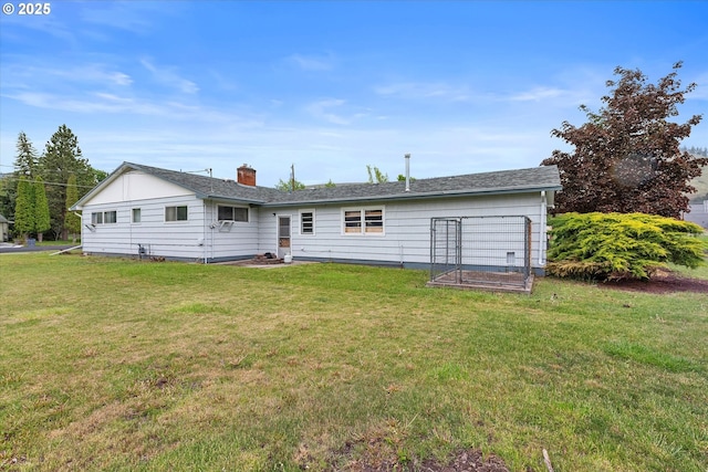 901 H Ave, La Grande, OR 97850 - rear view of house with a yard, a chimney, and a vegetable garden