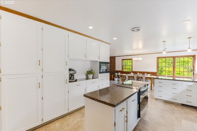 26127 NW Williams Canyon Rd, Gaston, OR 97119 - kitchen with electric stove, black microwave, white cabinetry, a chandelier, and recessed lighting