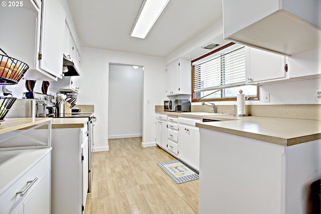 21408 SE Main St, Gresham, OR 97030 - kitchen with a sink, light wood-style flooring, under cabinet range hood, white range, and white cabinets