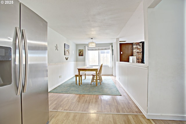 21408 SE Main St, Gresham, OR 97030 - dining area with wood finished floors, a wainscoted wall, and baseboards