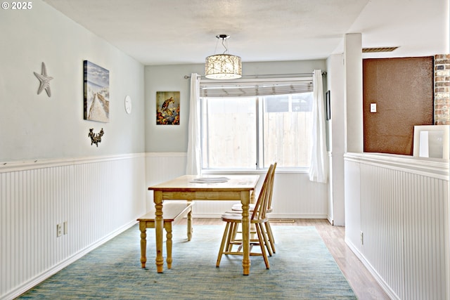 21408 SE Main St, Gresham, OR 97030 - dining space featuring wood finished floors and wainscoting