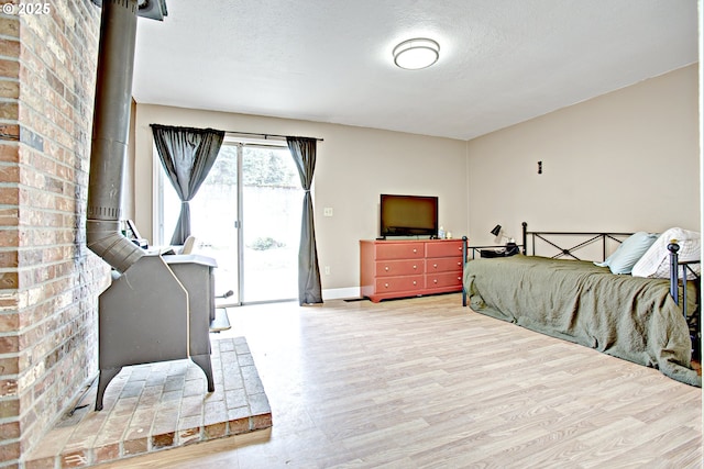 21408 SE Main St, Gresham, OR 97030 - bedroom featuring access to exterior, wood finished floors, baseboards, and a textured ceiling