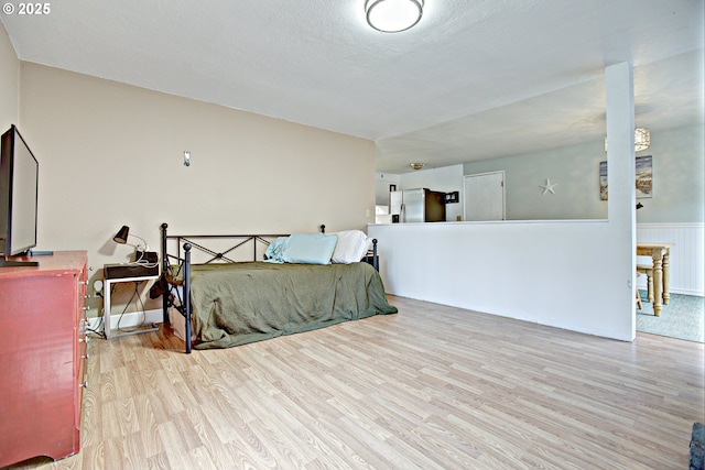 21408 SE Main St, Gresham, OR 97030 - bedroom featuring stainless steel refrigerator with ice dispenser and wood finished floors