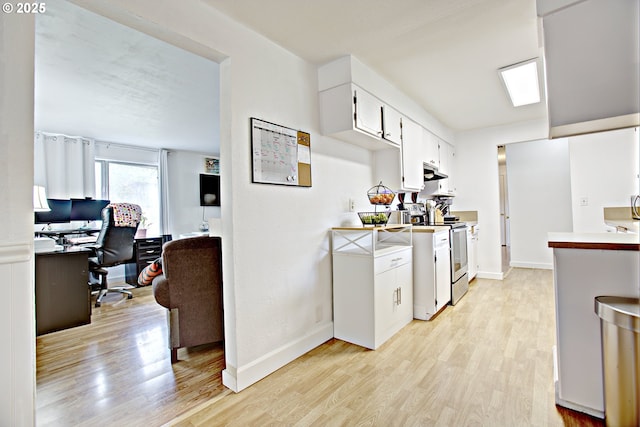 21408 SE Main St, Gresham, OR 97030 - kitchen with light wood-style floors, light countertops, a desk, and white cabinetry