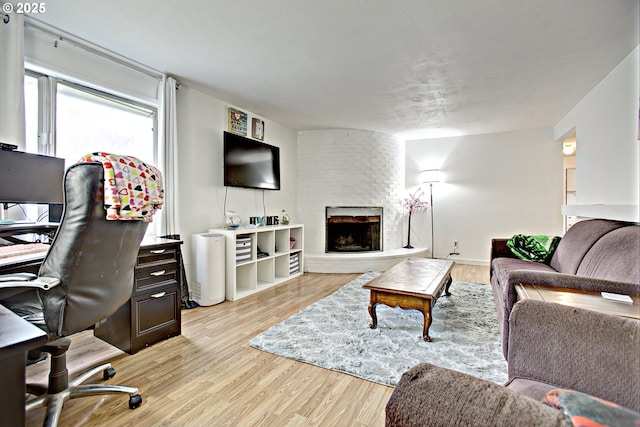 21408 SE Main St, Gresham, OR 97030 - living room featuring an office area, a fireplace, and light wood-style floors