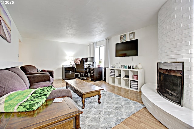21408 SE Main St, Gresham, OR 97030 - living area with a brick fireplace, light wood finished floors, and an office area