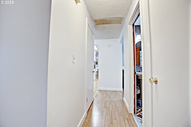 21408 SE Main St, Gresham, OR 97030 - hall featuring a textured ceiling, light wood-type flooring, and baseboards