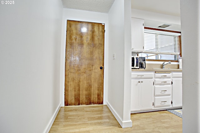 21408 SE Main St, Gresham, OR 97030 - hallway with a sink and light wood-style floors