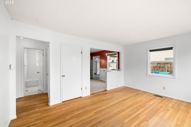 unfurnished room featuring light hardwood / wood-style flooring