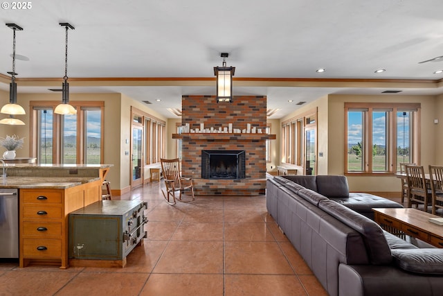 10771 E Langell Valley Rd, Bonanza, OR 97623 - living room with a brick fireplace, recessed lighting, and light tile patterned flooring