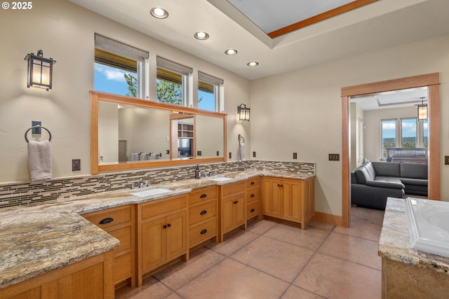 10771 E Langell Valley Rd, Bonanza, OR 97623 - full bath with plenty of natural light, decorative backsplash, vanity, recessed lighting, and tile patterned flooring