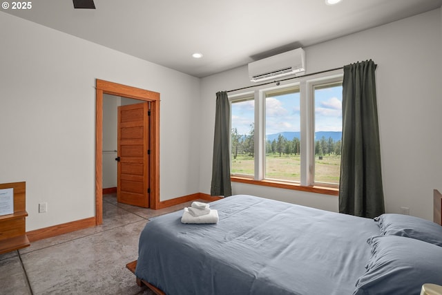 10771 E Langell Valley Rd, Bonanza, OR 97623 - bedroom with a wall unit AC, recessed lighting, and concrete floors