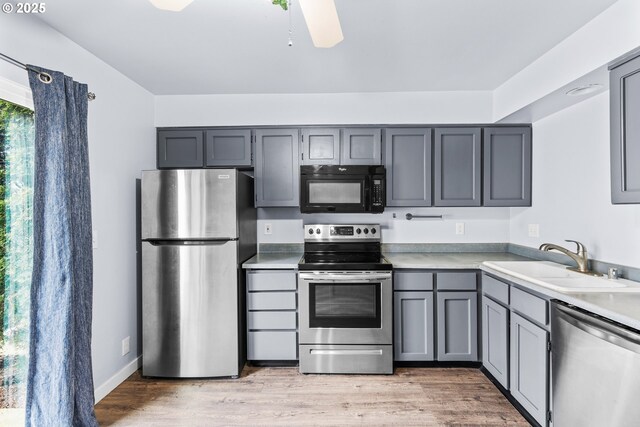5304 NE 84th Loop Unit 16, Vancouver, WA 98662 - kitchen with appliances with stainless steel finishes, a sink, gray cabinets, light countertops, and ceiling fan