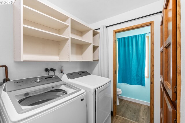 5304 NE 84th Loop Unit 16, Vancouver, WA 98662 - laundry area featuring washer and dryer, dark wood-style floors, and baseboards