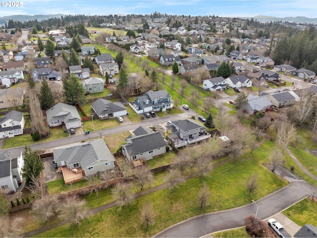 birds eye view of property with a residential view