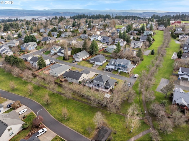 drone / aerial view with a residential view and a mountain view