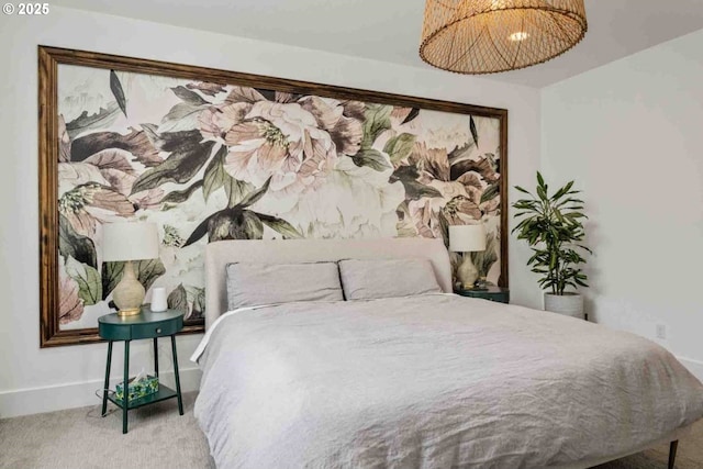 carpeted bedroom featuring baseboards