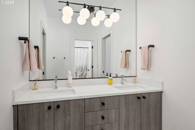 bathroom featuring double vanity and a sink